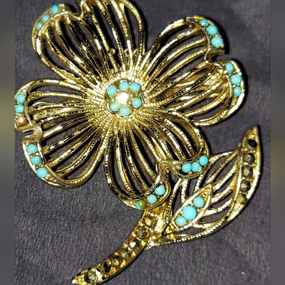 Vintage Lisner Filigree Flower Brooch with stones along petals and leaves